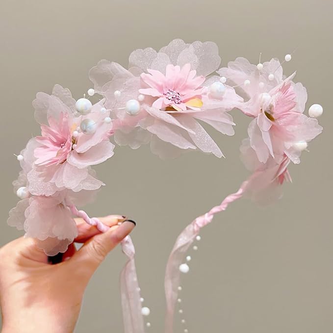 Elegant floral headband adorned with delicate fabric flowers and pearls, perfect for weddings or romantic occasions."