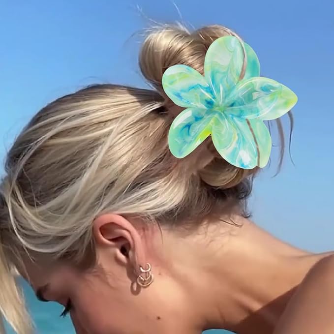 A handcrafted silk flower hair clip featuring delicate petals and a secure metal clasp, perfect for weddings or romantic styling.