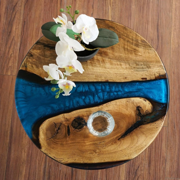 Handmade resin dining table with natural wood and epoxy river design