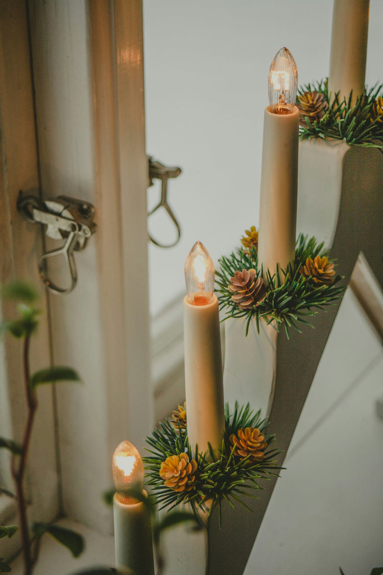 Holiday table set with seasonal flower candle holders